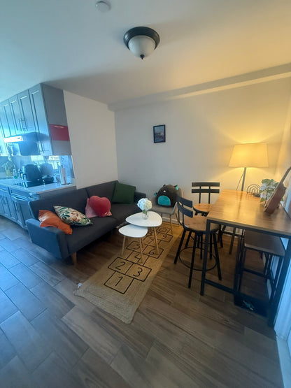 I am looking for a roommate (one person) in a clean and new apartment, one block from the R,M,E subway.